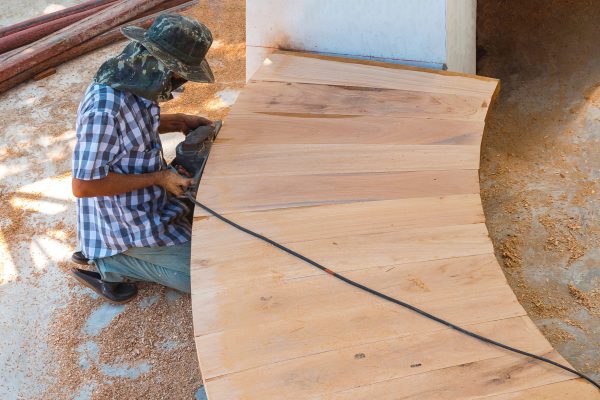 carpenter-using-electric-planer-to-shaving-edge-of-2025-03-11-10-09-23-utc (1)